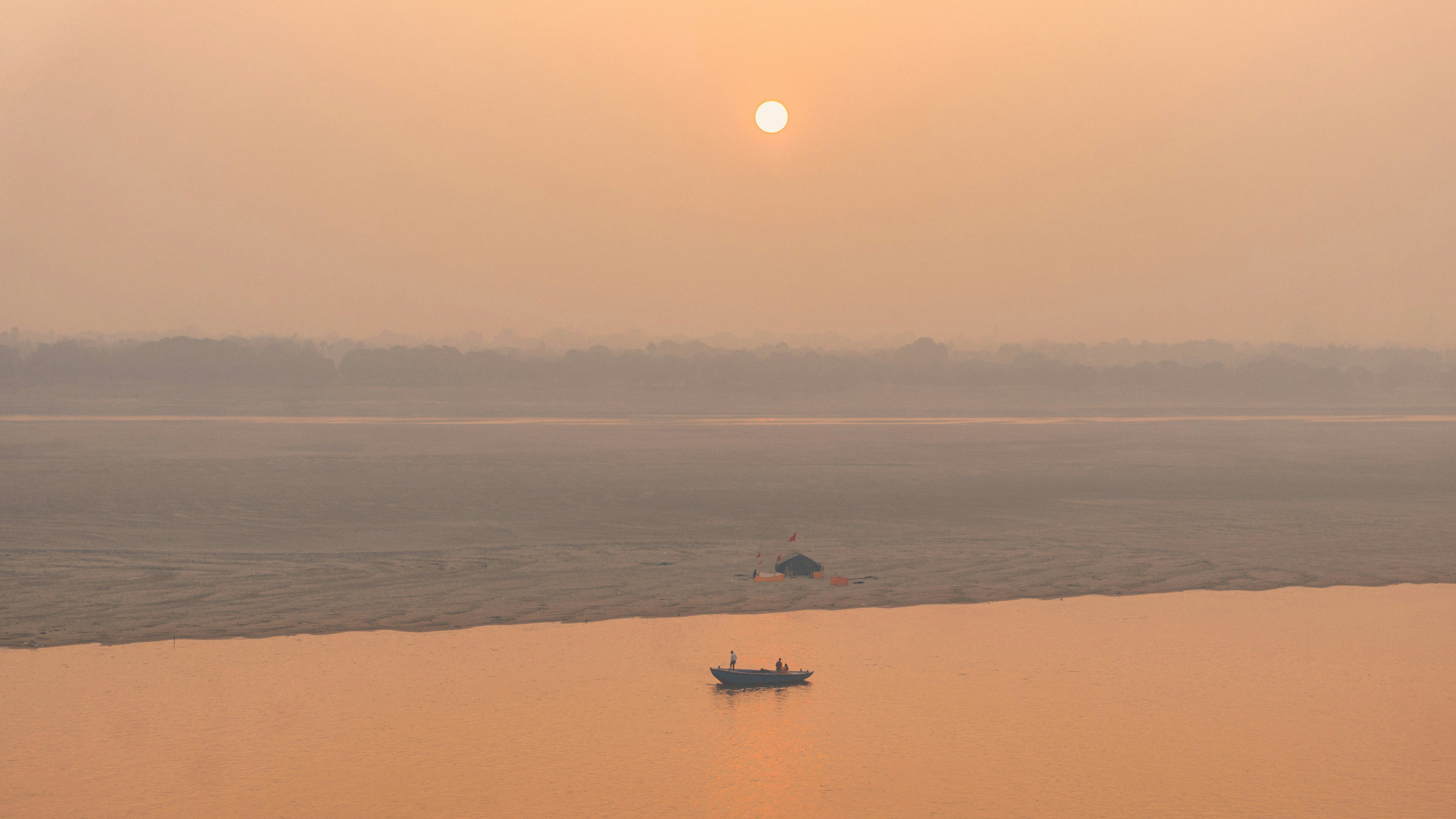 sunrise view of ghats of varanasi on the ganges river